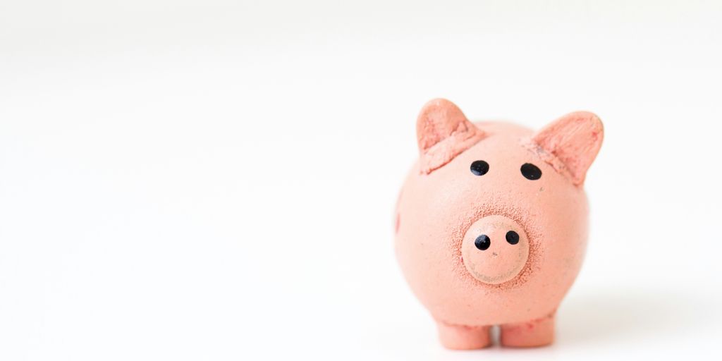 What is Money Laundering? 2 pink pig figurine on white surface